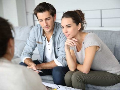 image of couple talking to an insurance agent